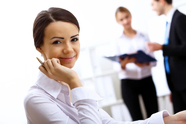 Portrait of a business woman in office Stock Picture