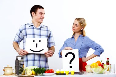 Husband and wife together coooking at home clipart