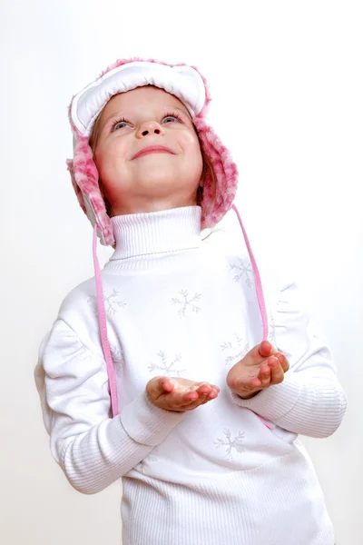 Kid in winter wear against white background — Stock Photo, Image