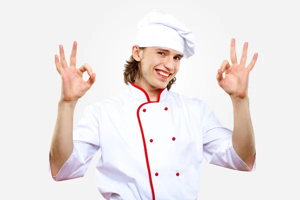 Retrato de um jovem cozinheiro em uniforme — Fotografia de Stock