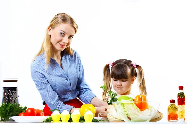 Young mother cooking at home with her daoghter — Stock Photo, Image