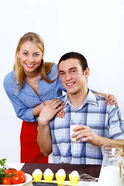 Husband and wife together coooking at home Stock Image