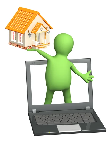 Marionet met laptop en huis — Stockfoto