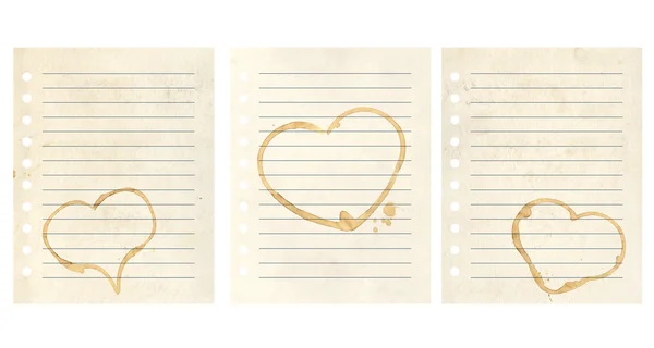 Herzen aus Kaffeetropfen auf Notizbuchseiten — Stockfoto