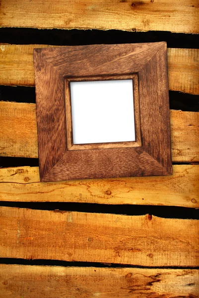 Old frame on wooden wall — Stock Photo, Image