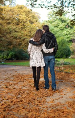 Romantic coouple in the Luxembourg garden of Paris, walking clipart