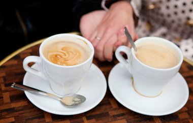 Dating couple in a cafe clipart