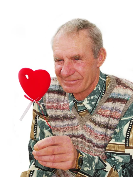 Senior behält falsches Herz. — Stockfoto