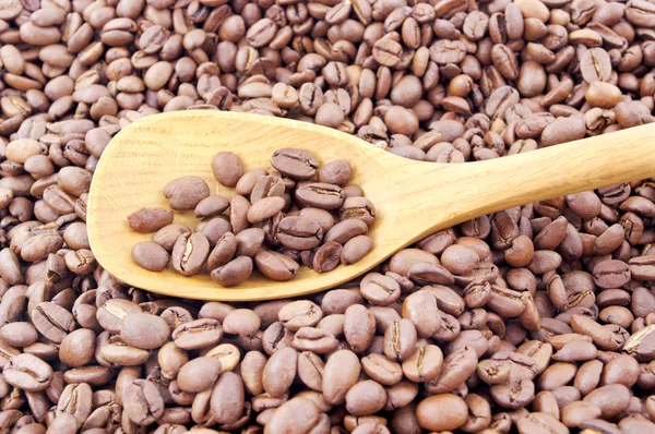 Spoon and caffee beans. — Stock Photo, Image