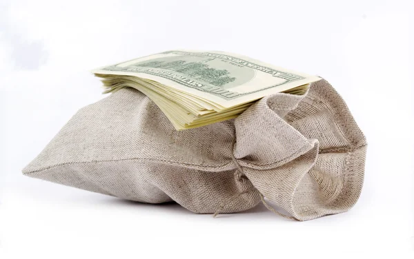Sackcloth bag and dollars. — Stock Photo, Image
