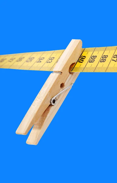 Clothespin and measuring tape. — Stock Photo, Image