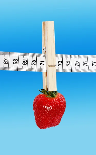 Strawberry and clothespin. — Stock Photo, Image