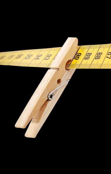 Clothespin and measuring tape. — Stock Photo, Image