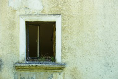 Grunge wall of the old house with window clipart