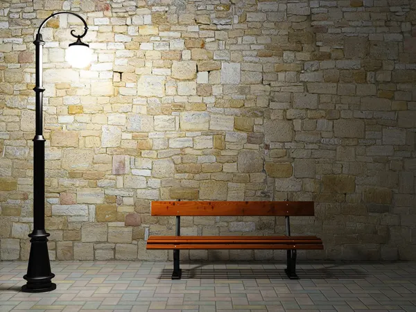 古い街灯とベンチと照らされたレンガ壁 — ストック写真