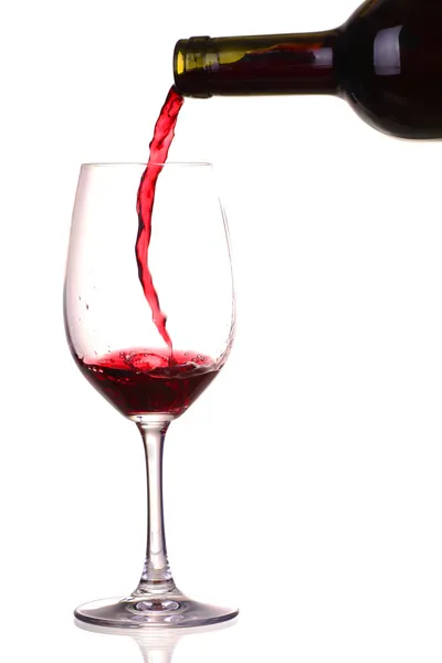Glass and a bottle of red wine Stock Image