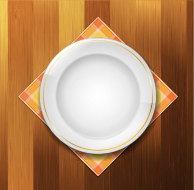 Plate with napkin on wood background clipart