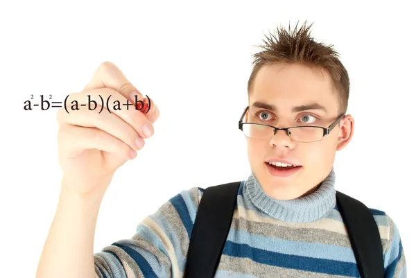 Schüler schreiben mathematische Formel auf Whiteboard — Stockfoto