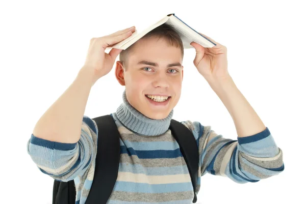 Kafasında kitapla genç, çekici, mutlu erkek öğrenci . — Stok fotoğraf