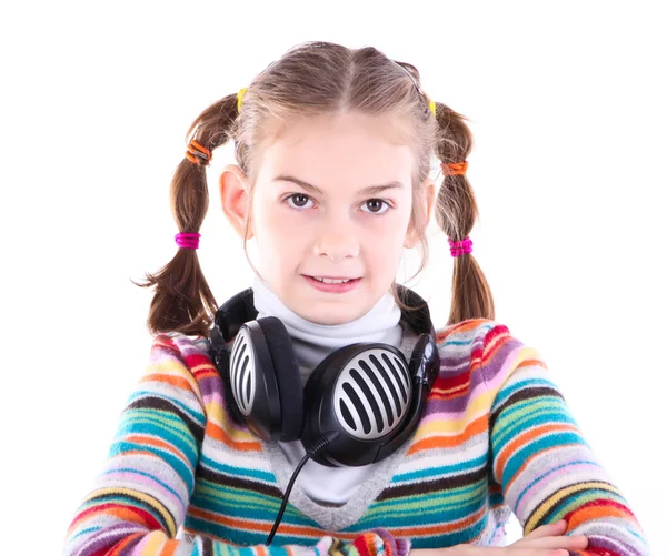 Klein meisje in hoofdtelefoon — Stockfoto