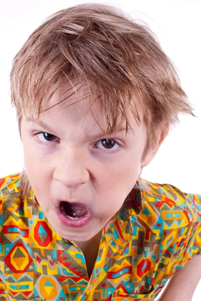 Angry boy against white background — Stock Photo, Image