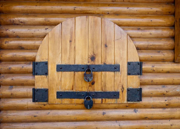 Rusty padlock on an old wooden window — Stock Photo, Image