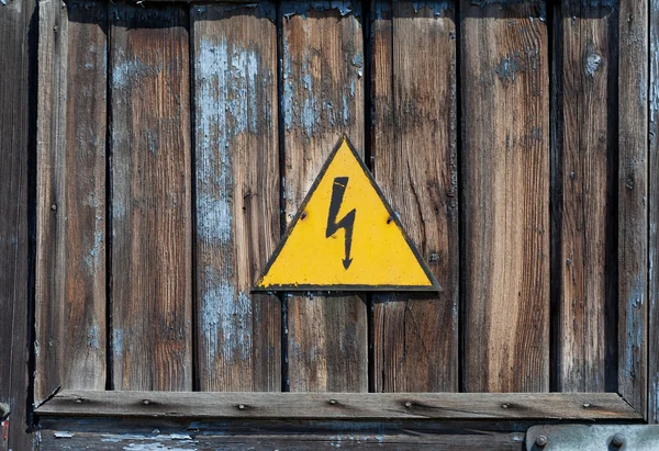 Old high voltage warning sign — Stock Photo, Image