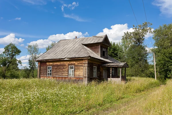 stock image Old wooden house in russian village