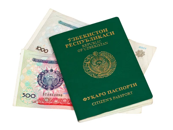 Uzbequistão passaporte e dinheiro isolado em fundo branco — Fotografia de Stock