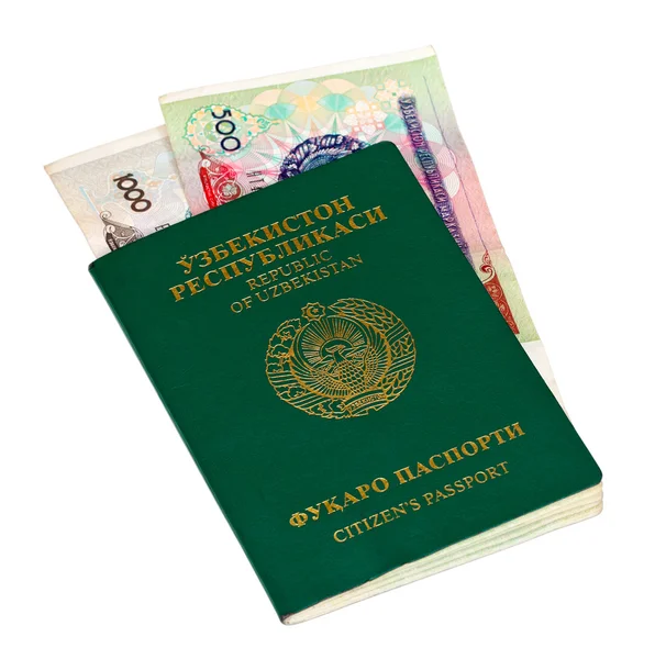 Uzbequistão passaporte e dinheiro isolado em fundo branco — Fotografia de Stock