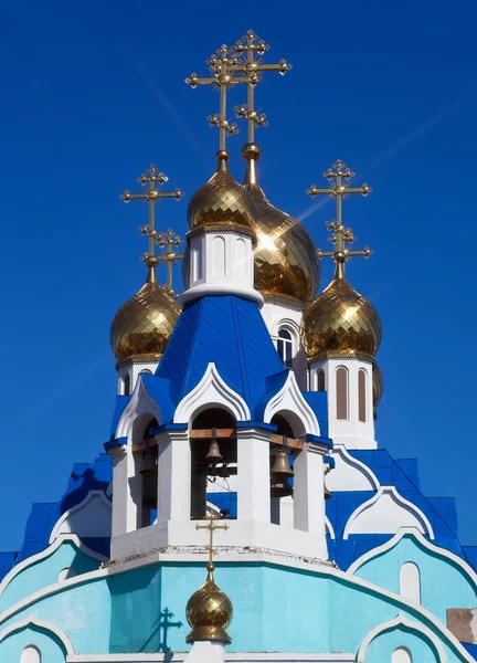 stock image Cupolas of Russian orthodox church against blue sky.