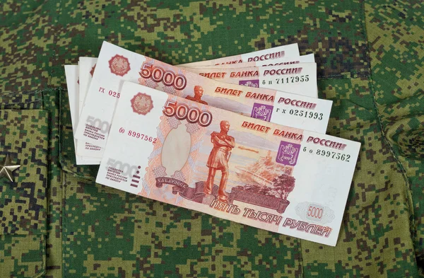 Banknotes on the military uniform — Stock Photo, Image