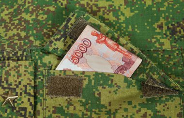 Banknotes in the military uniform pocket clipart