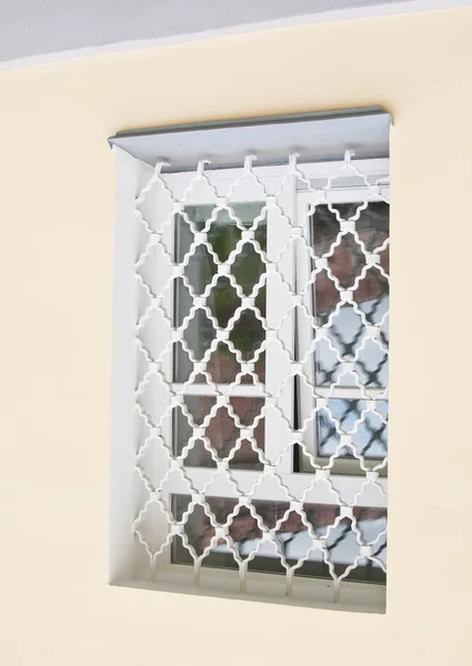 An old window with grille — Stock Photo, Image