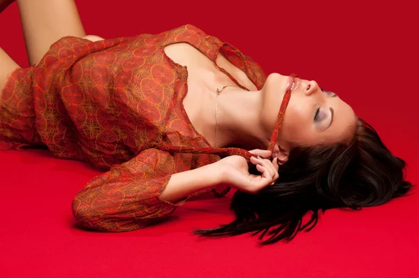 Brunette lying on the floor — Stock Photo, Image