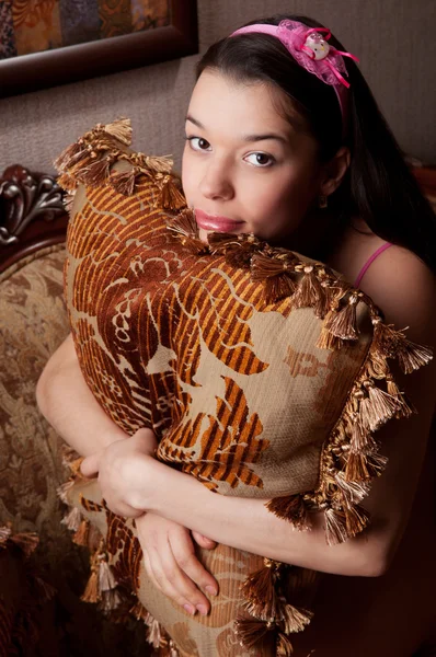 Woman with a pillow — Stock Photo, Image