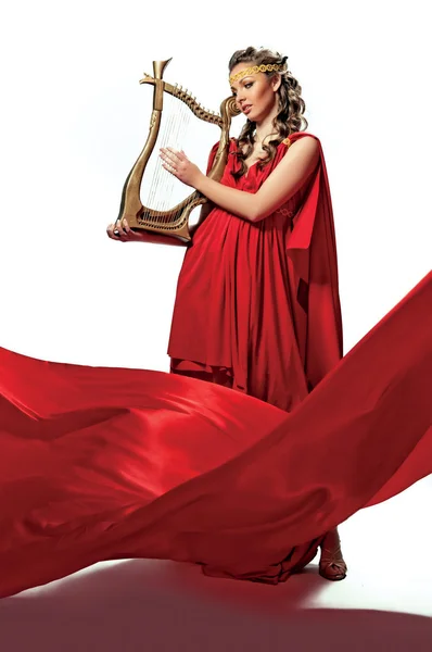 Cute girl in a red tunic — Stock Photo, Image