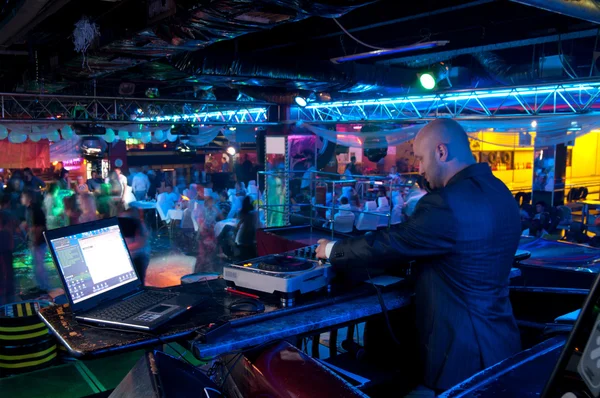 stock image DJ behind the control panel