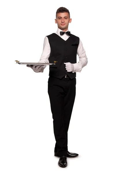 Ein junger Kellner mit einem Tablett — Stockfoto