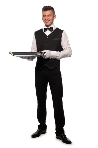 Ένα νεαρό αγόρι σερβιτόρος με ένα δίσκο — Φωτογραφία Αρχείου