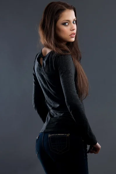 Young sexy woman in blue jeans — Stock Photo, Image