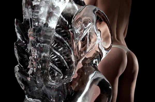 Woman and a crystal statue — Stock Photo, Image