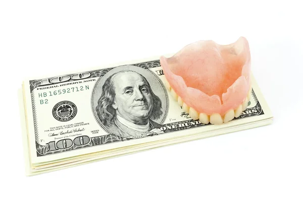 Dental konstgjorda lem och dollar — Stockfoto