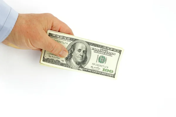 Dólares em uma mão do homem de negócios — Fotografia de Stock