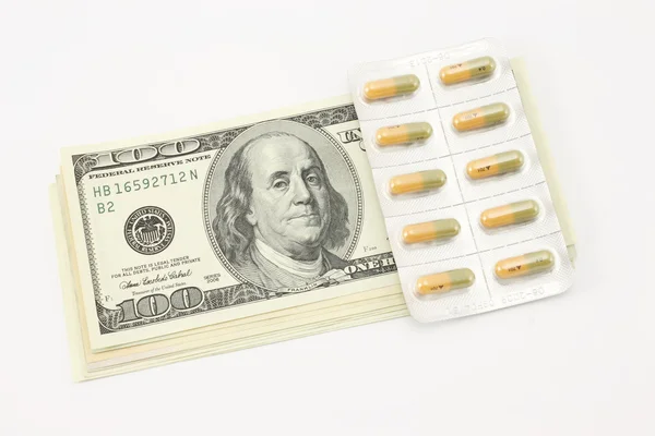 Dollars and medications — Stock Photo, Image