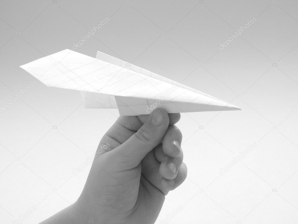 Child hand with paper plane