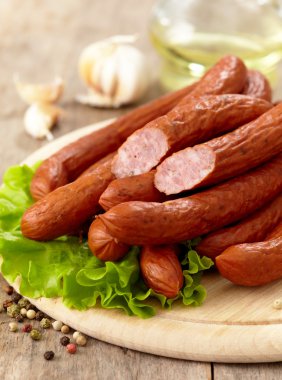 Delicious smoked sausages clipart