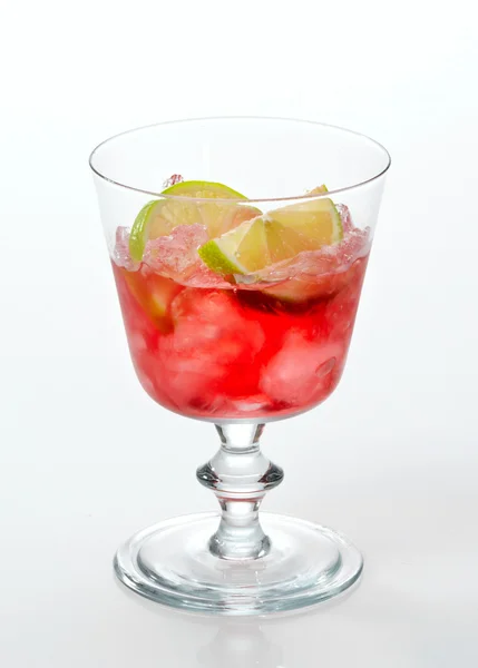 Red cold drink with ice and lime — Stock Photo, Image