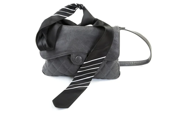 Kvinnliga väska och mannens slips isolerad på en vit — Stockfoto