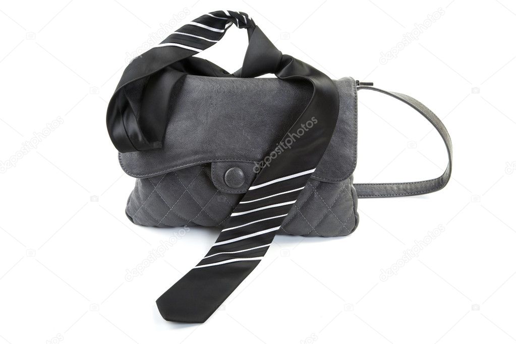 Female bag and man's tie isolated on a white